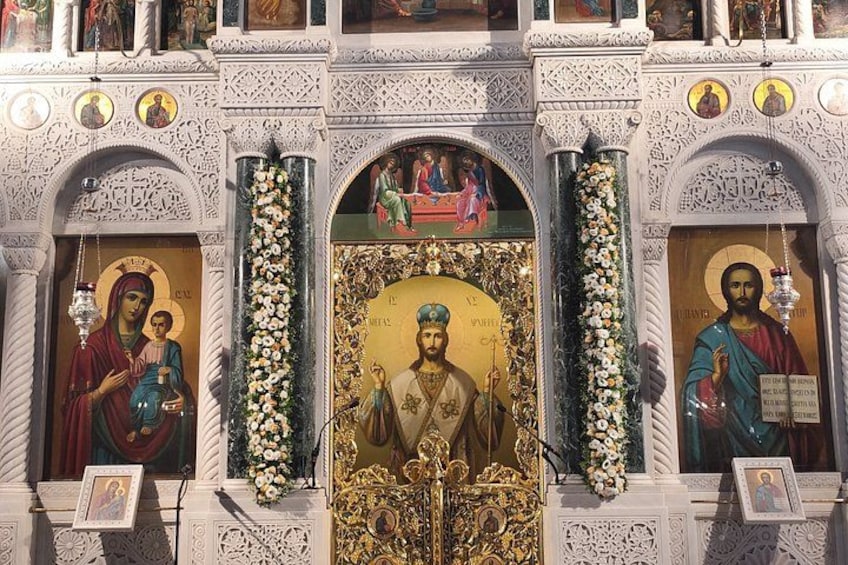 An ornate religious iconostasis with religious paintings and icons. 2