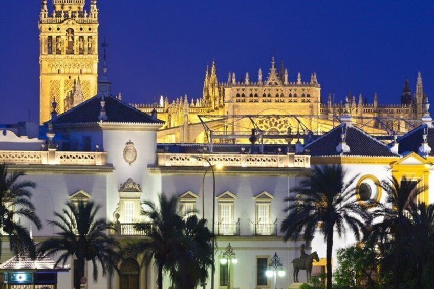 A historic building with ornate architecture, including a tower and a large facade with intricate details. 2