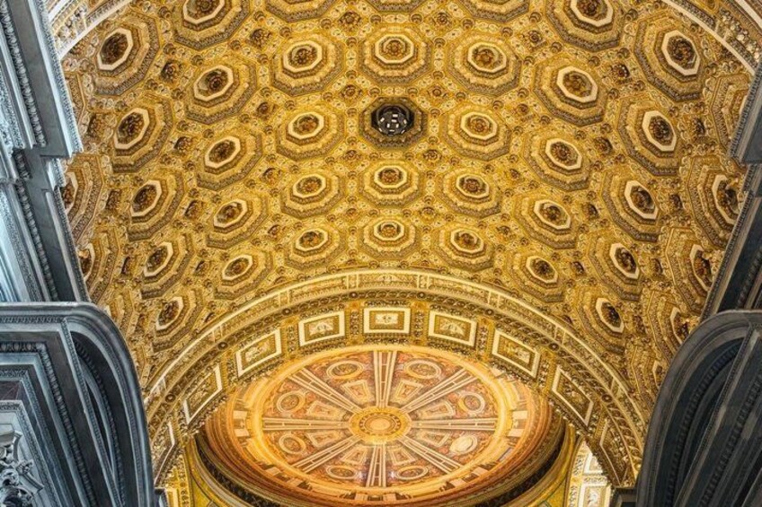 A golden dome with intricate patterns and a central circular design. 2