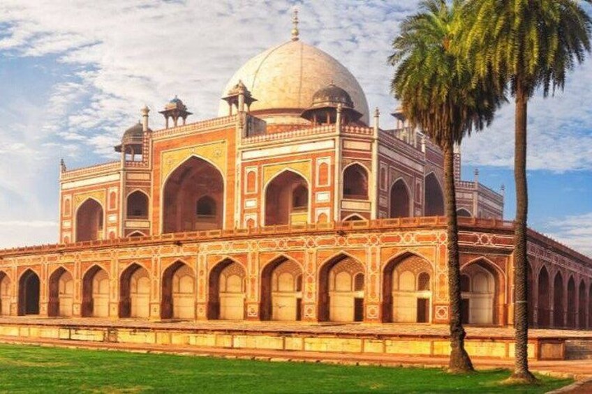 A large, ornate building with a central dome and multiple arches. 2