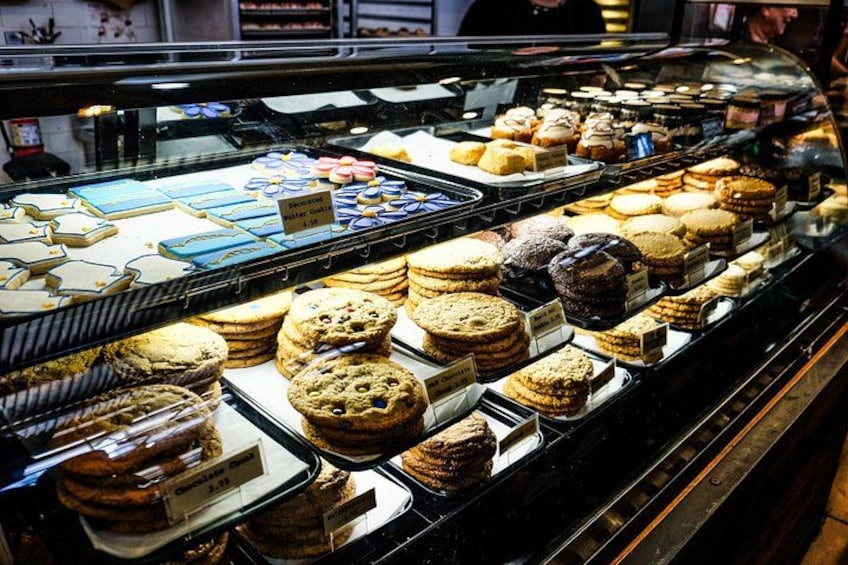 A bakery display case with various baked goods. 4