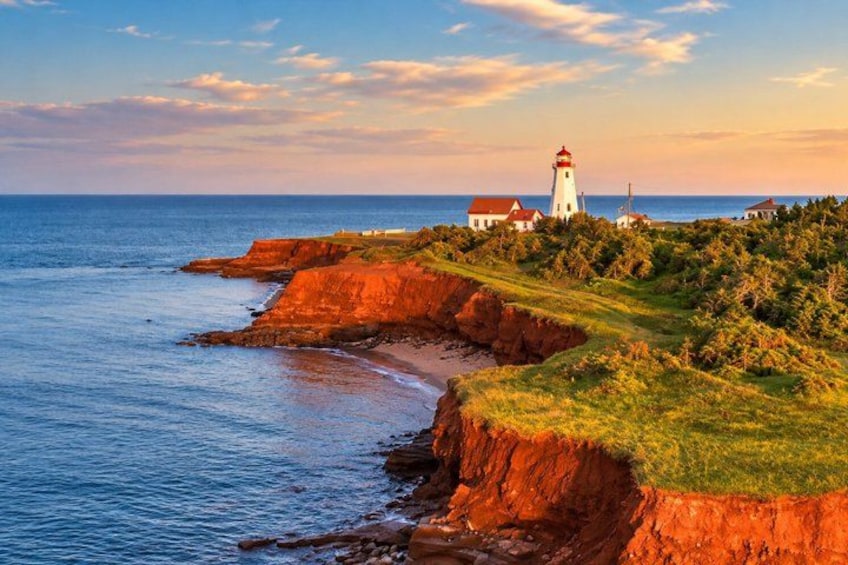 A coastal landscape with a lighthouse, cliffs, and ocean. 1