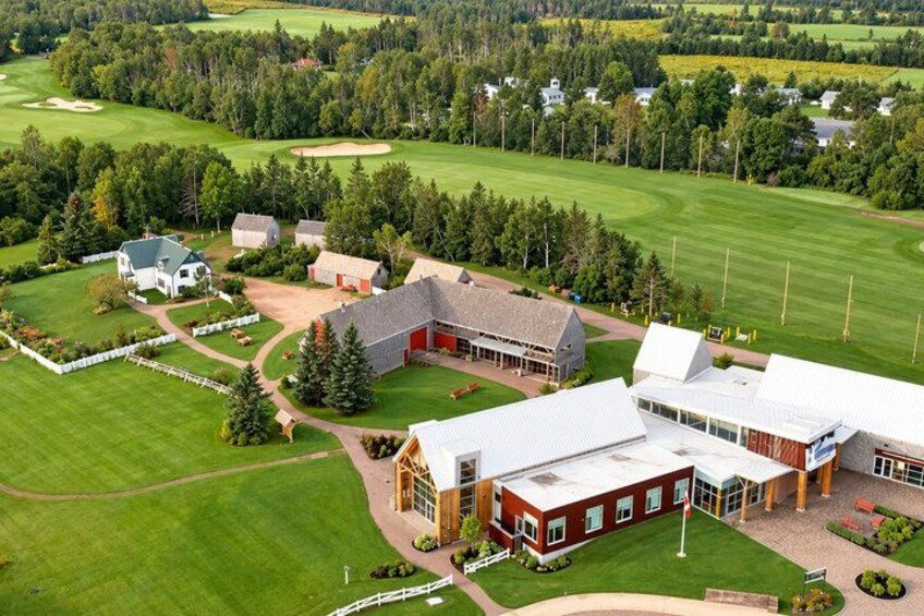 A golf course with a clubhouse and residential buildings. 5