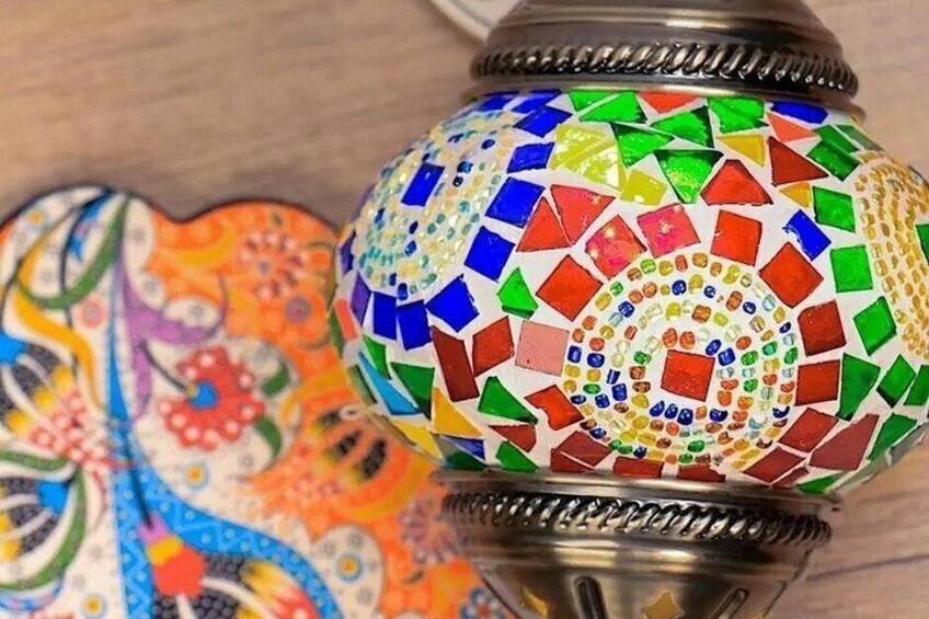 A colorful mosaic lamp with a floral pattern. 2