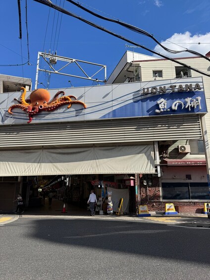 A building with an octopus sign and Japanese text. 2