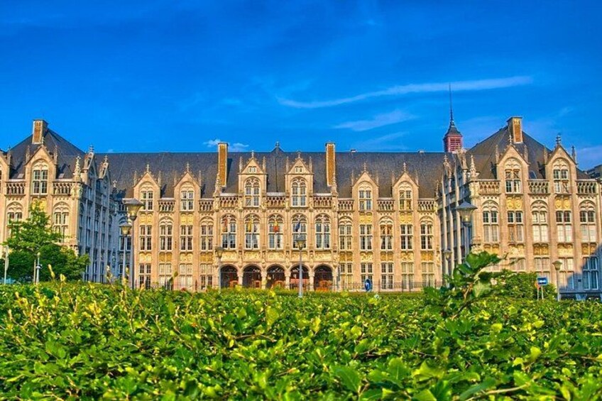 A historic building with ornate architecture, surrounded by lush greenery. 4