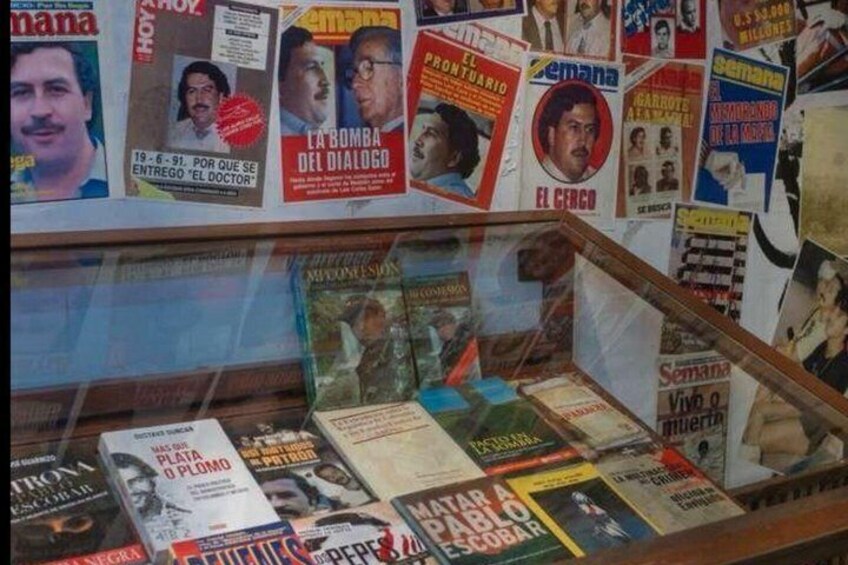 A display of books and magazines with visible titles and covers. 5