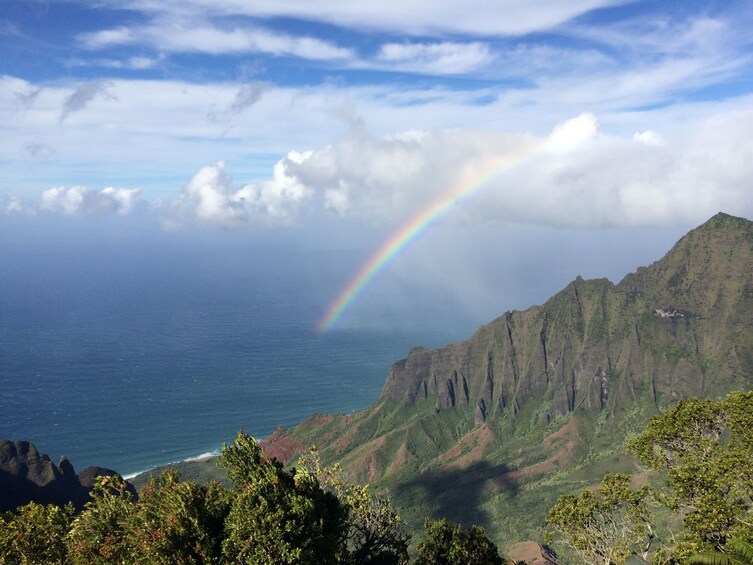 A mountain landscape with a visible rainbow. 5