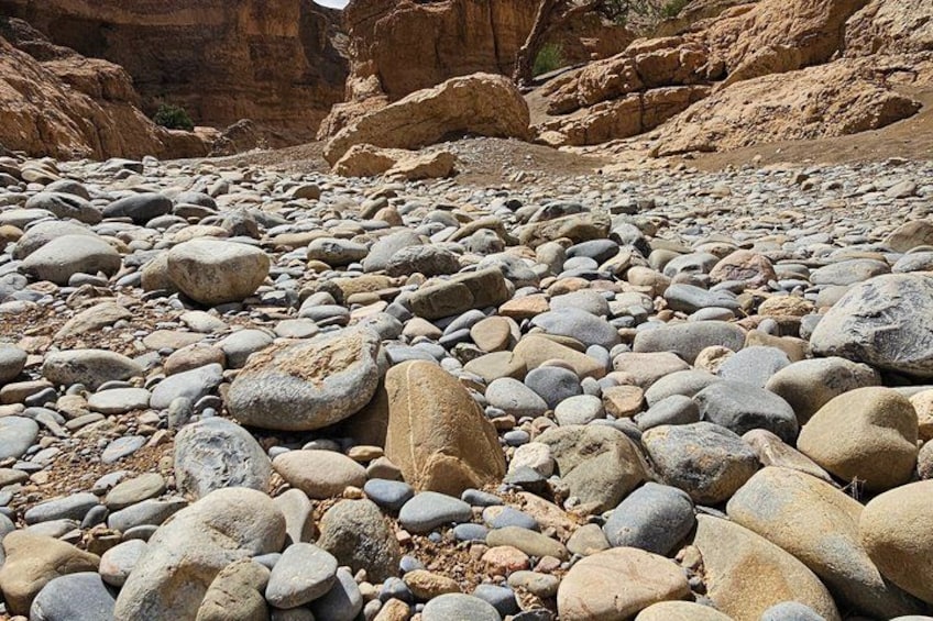 A rocky terrain with various sized stones and boulders. 4