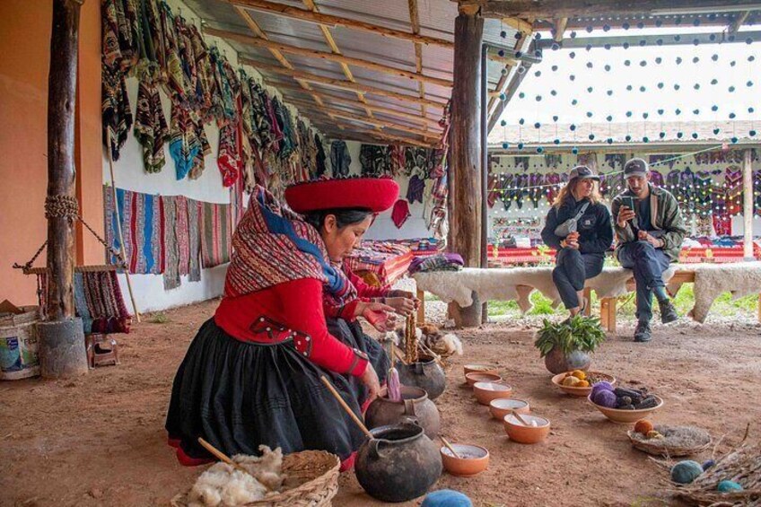 A person cooking with pots and bowls, a market stall with colorful textiles, and a person sitting on a bench. 2