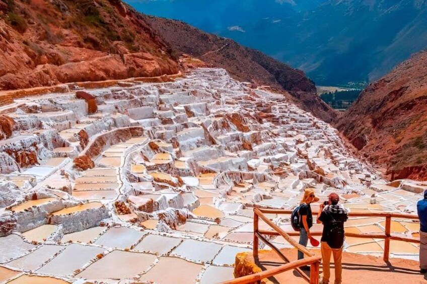 Terraced salt flats with people standing on the edge. 5