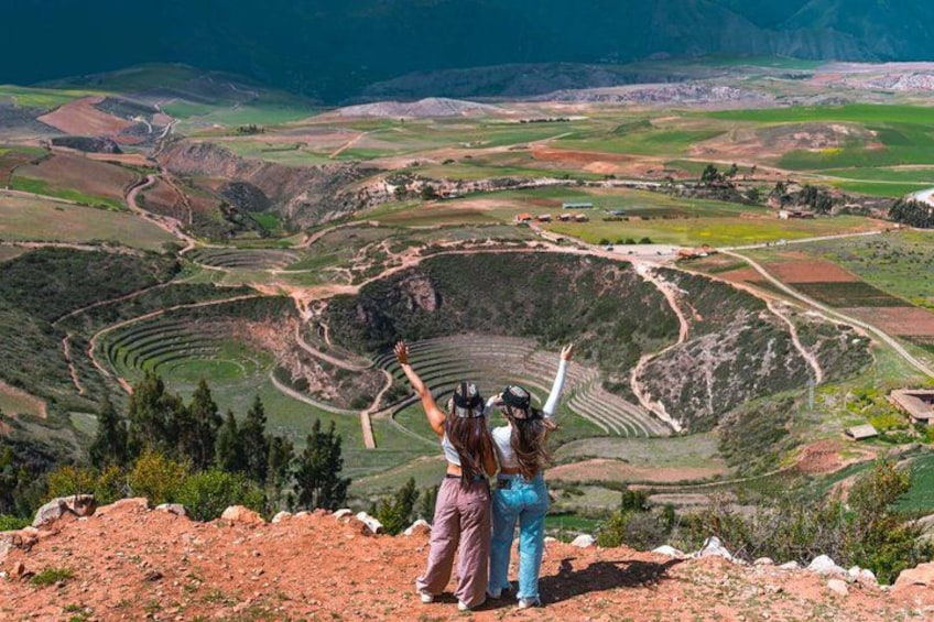 A valley with terraced fields and a large open area. 1