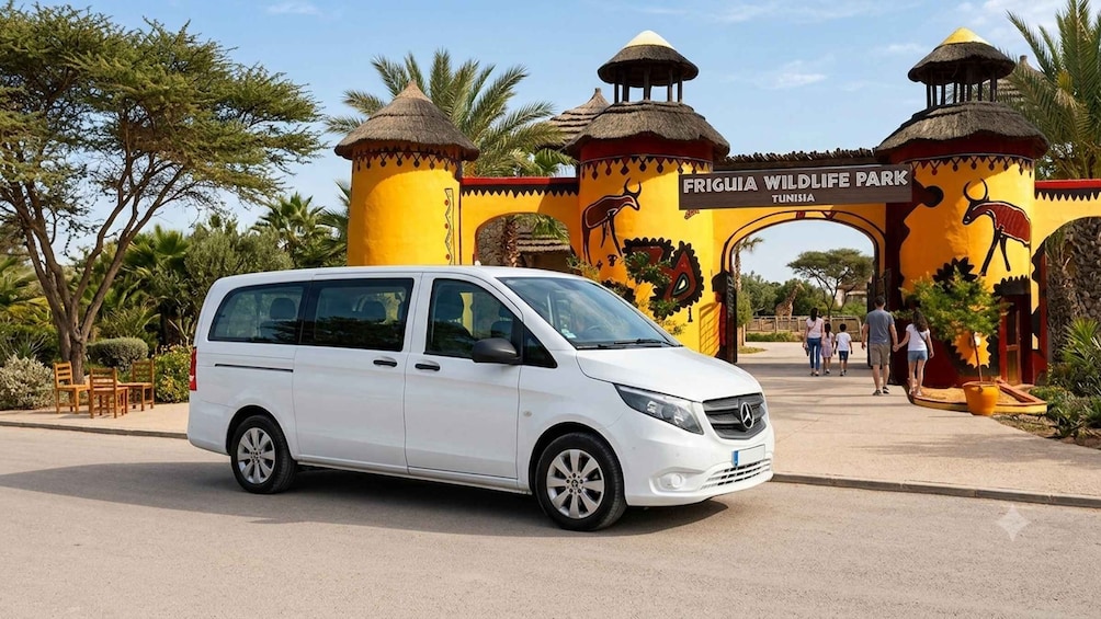 A white van parked in front of Friguia Wildlife Park entrance in Tunisia. 4
