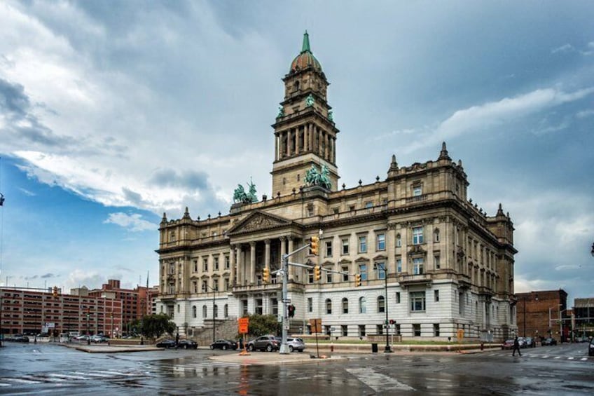 A historic building with a prominent tower and classical architecture. 3