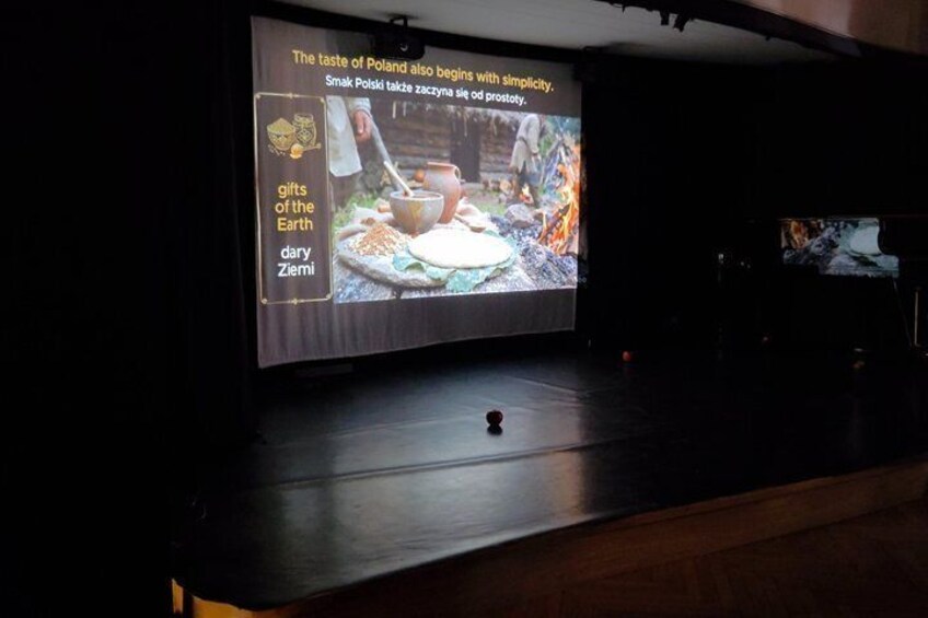 A television screen displaying a cooking scene with a wooden table and a bowl. 5