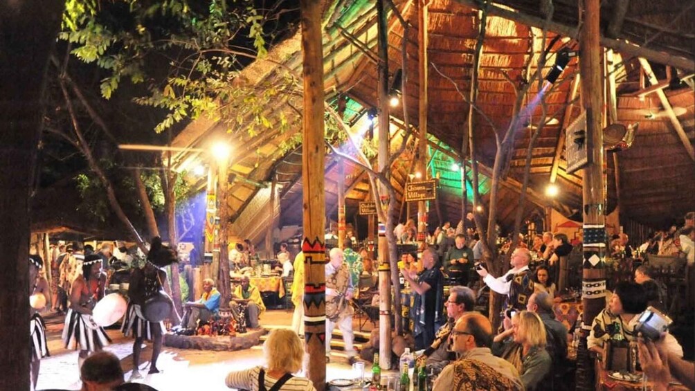 Picture 1 for Activity Victoria Falls: Boma Dinner with Drum Show and Transfers 5