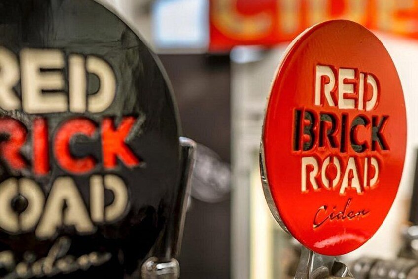 Two signs with the text 'RED BRICK ROAD' and 'Cider.' 2