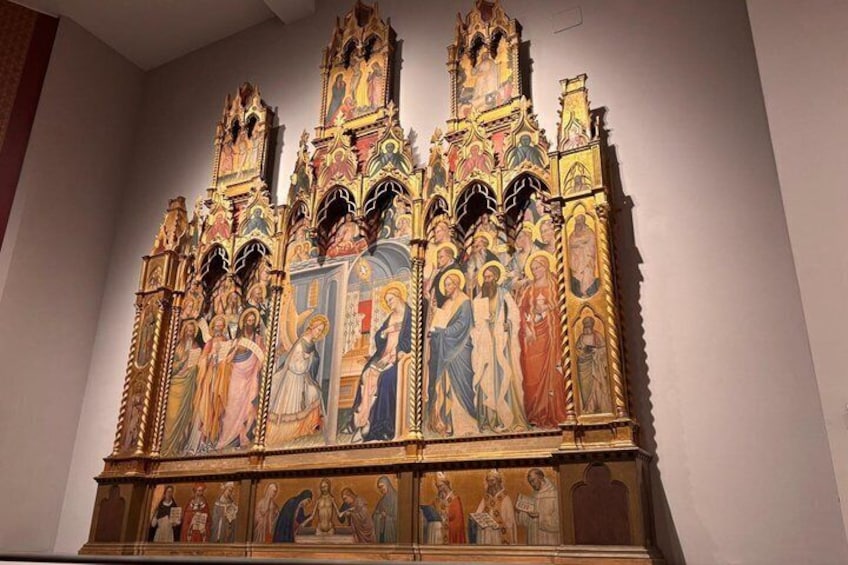 A detailed religious iconostasis with multiple tiers of icons and figures. 3