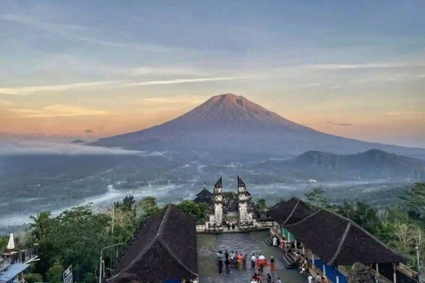 A volcano, a temple, and a coastal area with people. 5