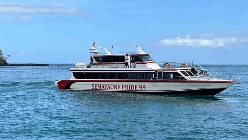 A boat named SEMAYAONE PRIDE 99 on the water. 2