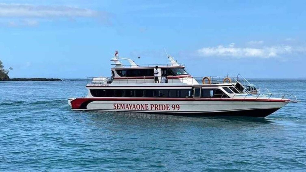 A boat named SEMAYAONE PRIDE 99 on the water. 3