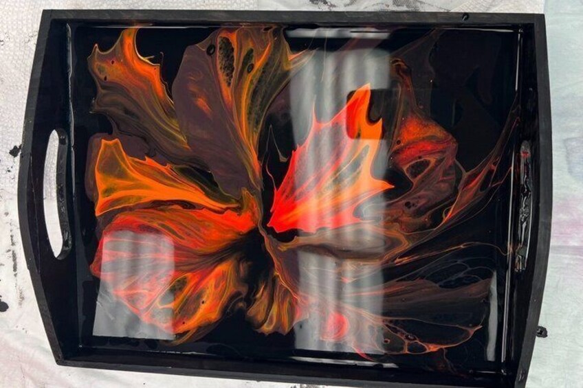 A glass container with a marbled design. 5