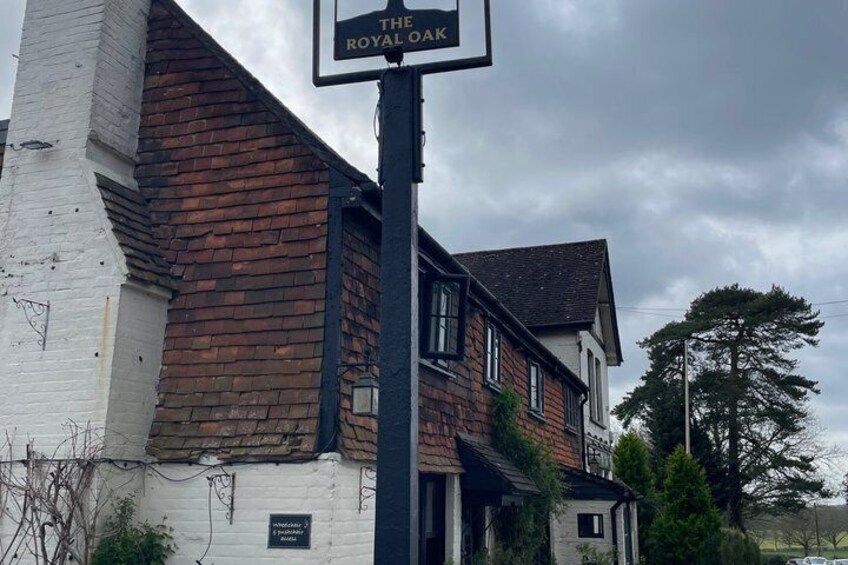A building with a sign reading 'The Royal Oak.' 3