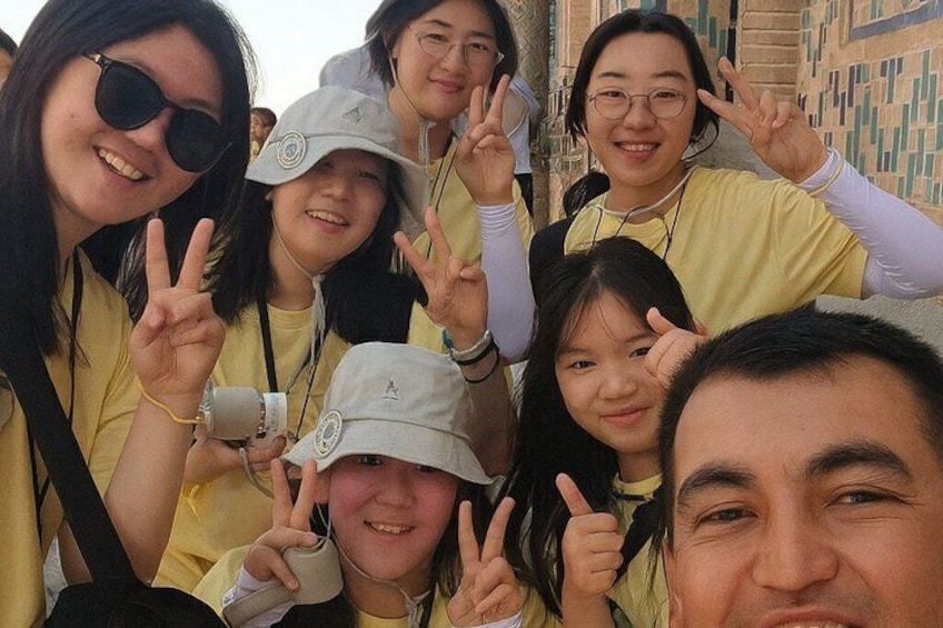 A group of people in yellow shirts posing for a photo. 1