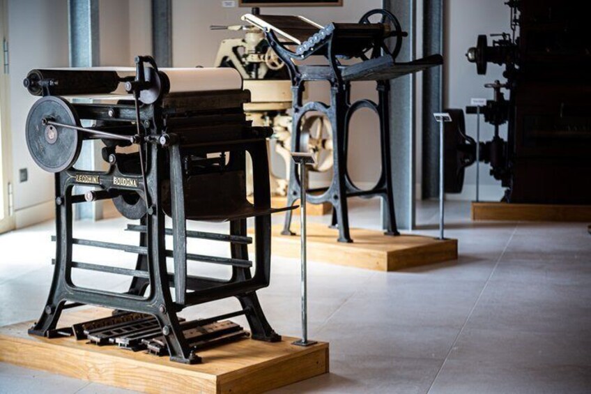 Vintage printing presses on display in a museum. 5