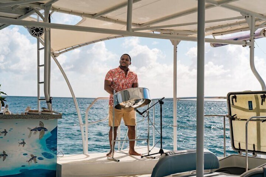 A person standing on a boat deck with a metal container, a white canopy, and a blue ocean in the background. 5