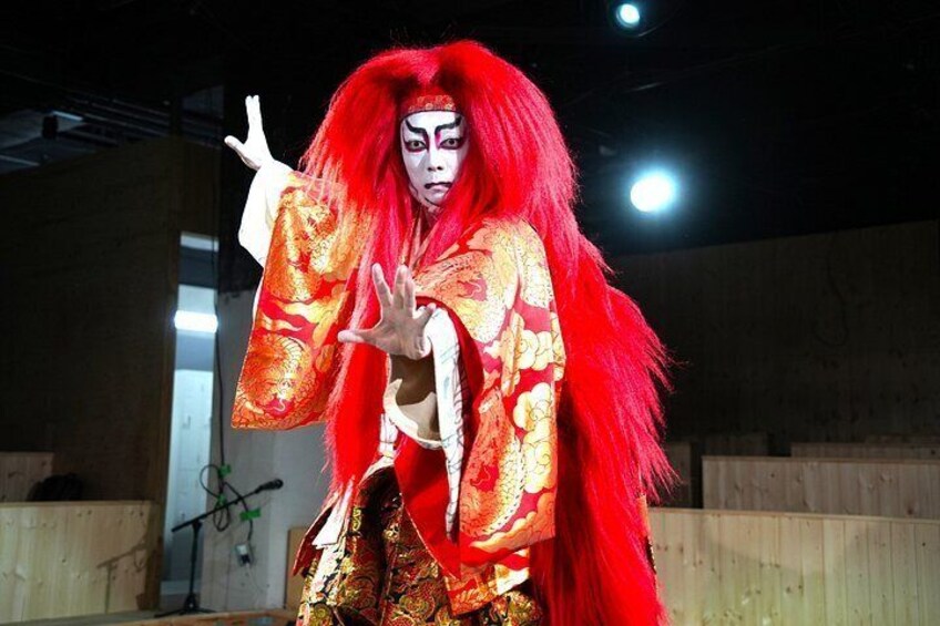 A person in a traditional costume with red hair and a kimono. 3