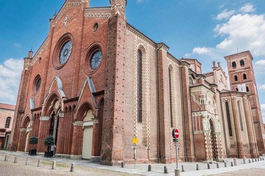 A large red brick church with multiple arched windows and a bell tower. 3