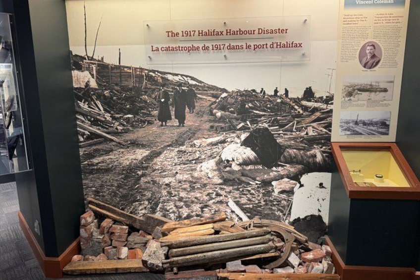 A historical exhibit about the 1917 Halifax Harbour Disaster with a large photograph and informational panels. 5