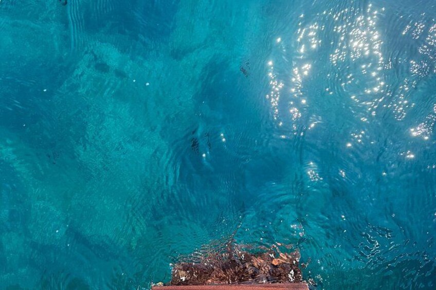 A clear blue pool with ripples and reflections. 2