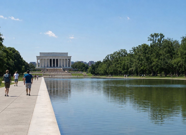 The Lincoln Memorial with a reflecting pool and people walking along the path. 3