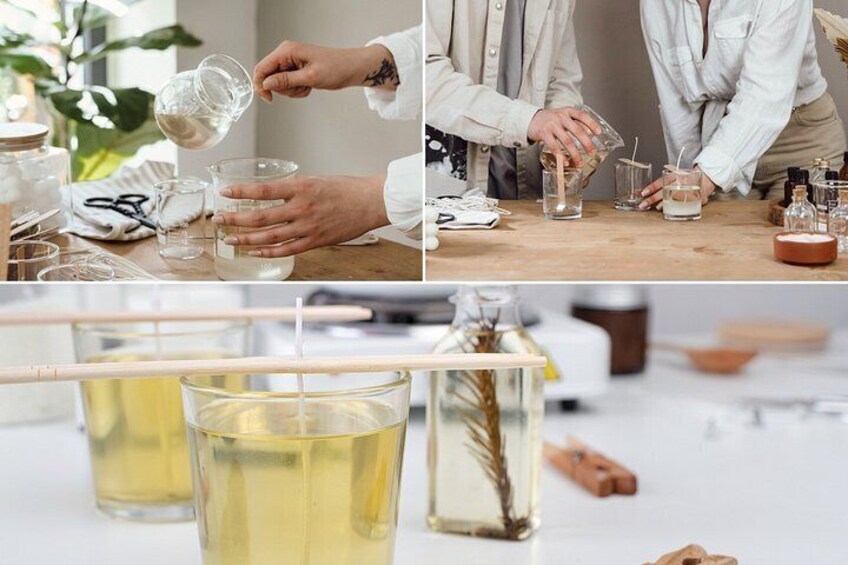 A person pouring liquid into a glass, with various containers and bottles on a table. 1