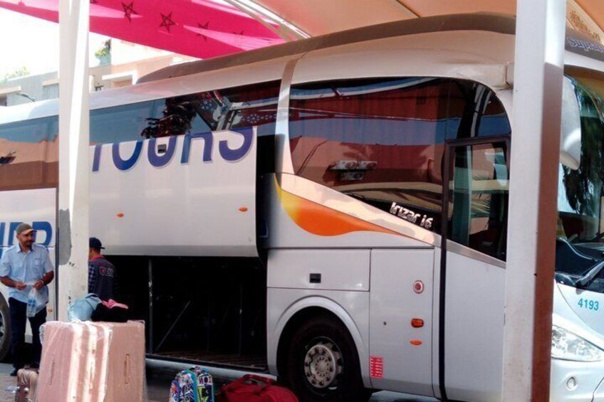 A bus with the number 4193 parked under a shelter. 2