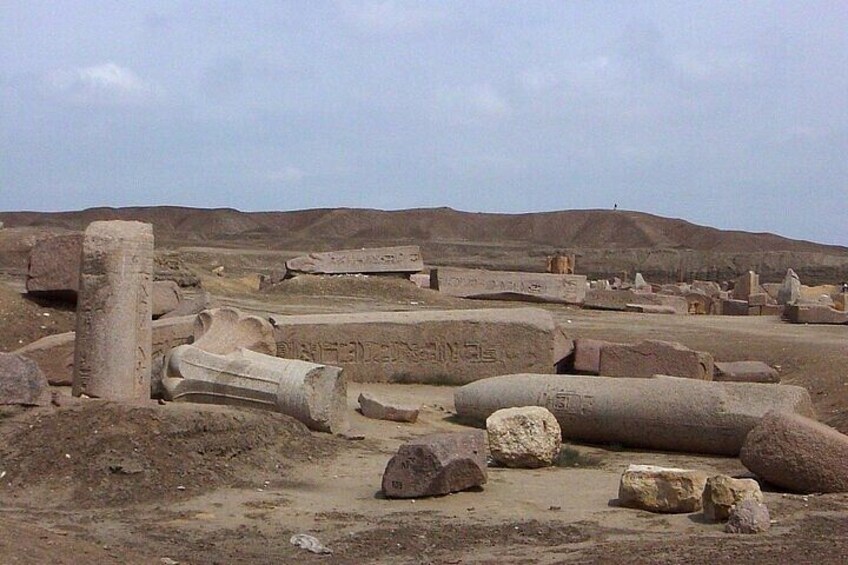 Ancient ruins with large stone blocks and columns. 5