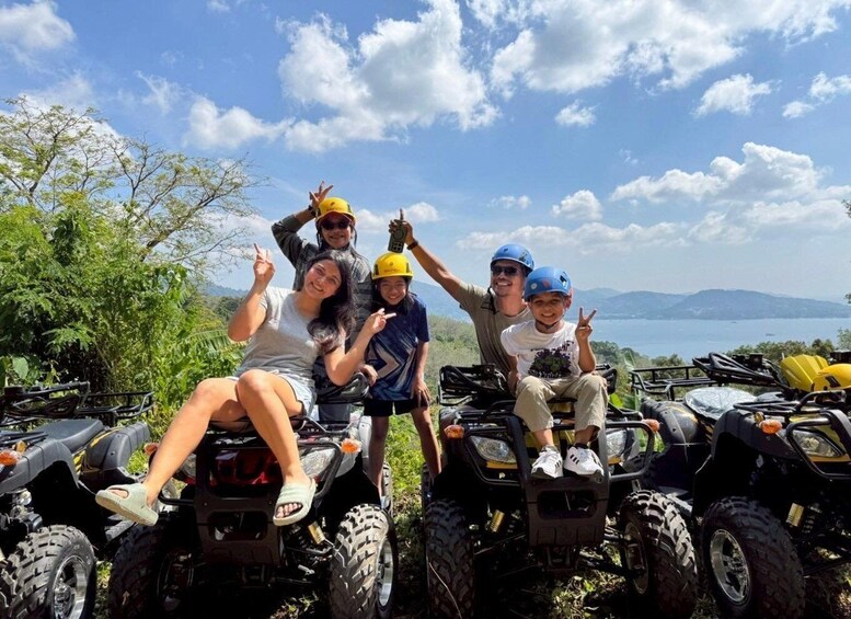 A group of people on ATVs with a scenic landscape in the background. 3