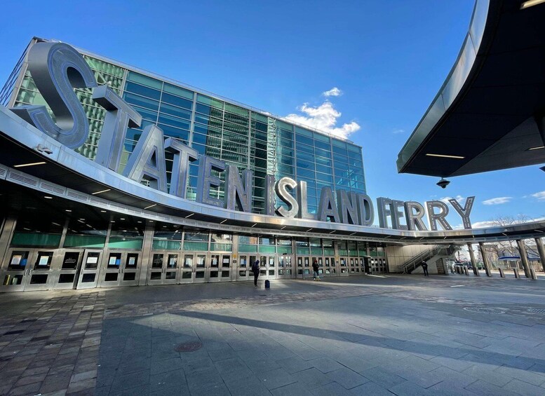 A modern building with large letters spelling 'STANISLA AND FERRY' on the facade. 4
