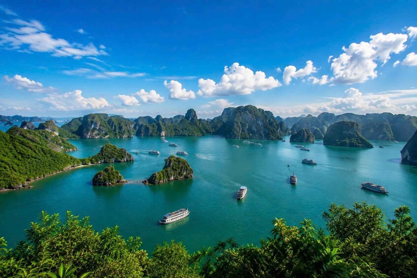 A coastal landscape with numerous islands and boats in the water. 1