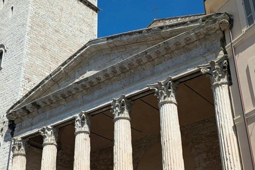 A classical building facade with columns and a pediment. 5