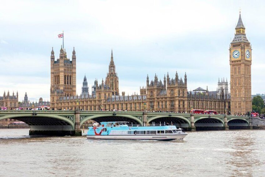 The Houses of Parliament and Big Ben in London, with a river and a bridge in the foreground. 5