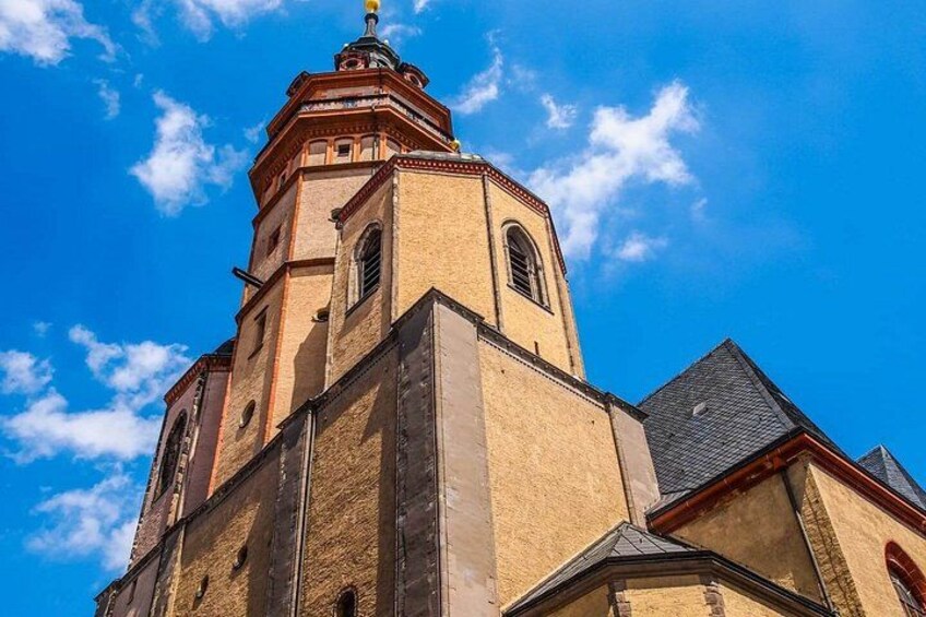 A church with a prominent bell tower and arched windows. 3