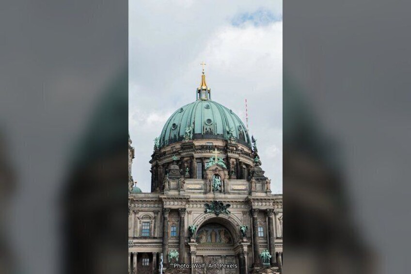 A large, ornate building with a prominent dome and intricate architectural details. 4