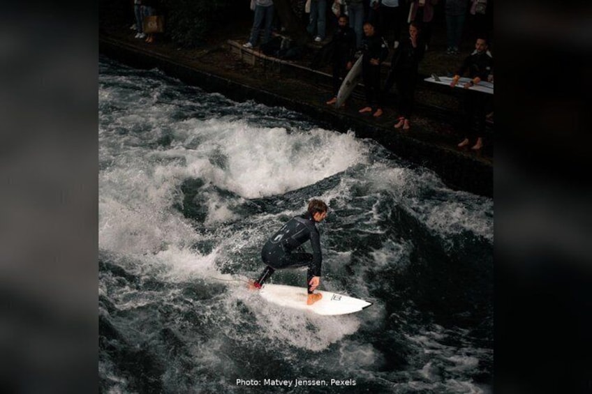 A person surfing on a wave in a river. 2