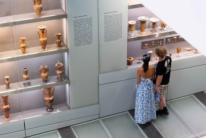 A museum exhibit with ancient Greek pottery on display. 2