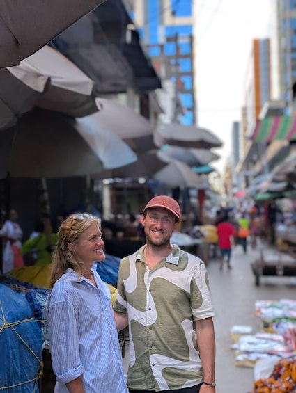 A street market with people browsing stalls. 5