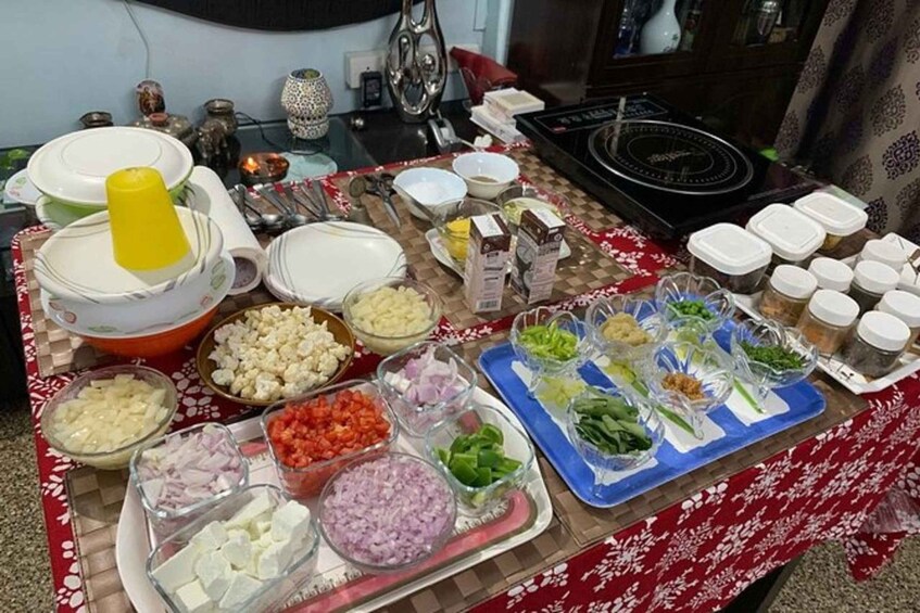 A buffet table with various food items and condiments. 5