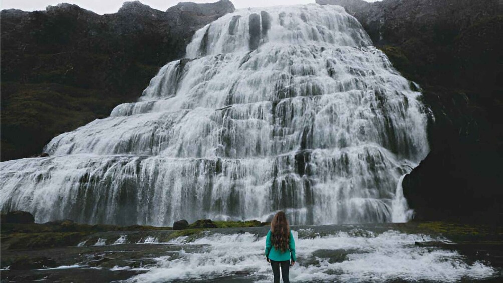 A waterfall cascading down a rocky cliff. 2